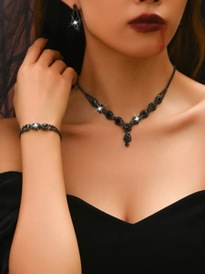Gothic black jewelry set with necklace and earrings on a model for Halloween cosplay