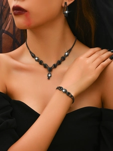Gothic black jewelry set featuring a necklace, bracelet and earrings for Halloween