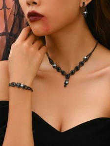 Gothic vampire bridal jewelry set featuring black gems and detailed metal craftsmanship