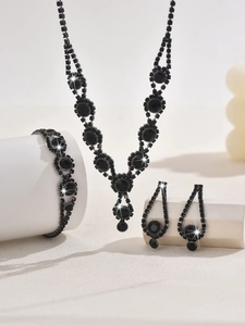 Detailed view of Gothic black crystal necklace and earrings set for Halloween weddings