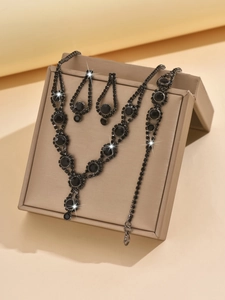 Macro view of Gothic black crystal bridal jewelry set with necklace and earrings
