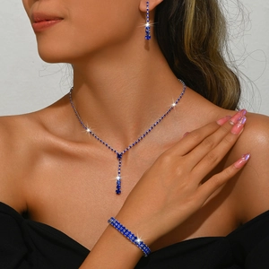 Elegant silver jewelry set with dark blue crystals including long necklace and bracelet