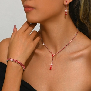Elegant silver jewelry set with red teardrop crystals including necklace earrings and bracelet