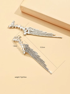 Detail view of long tassel earrings with sparkling rhinestones, 12.2cm in length
