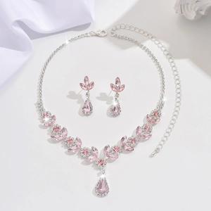 Luxurious bridal jewelry set with pink crystal necklace and drop earrings in silver finish