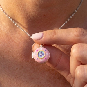 Pink donut pocket watch necklace with colorful hearts and Roman numerals on silver chain