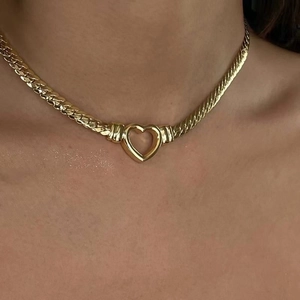 Flat snake chain necklace in 18K gold finish with a minimalist hollow heart pendant