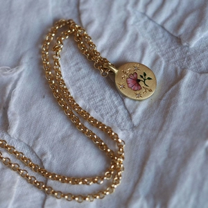 Vintage gold pendant necklace with hand-painted pink floral enamel and star accents