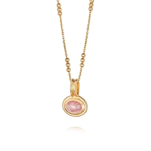 Detailed macro view of the gold chain necklace featuring a natural pink gemstone pendant