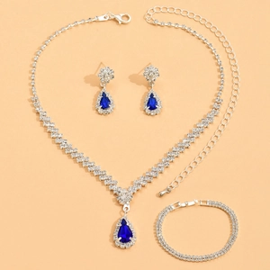 Detailed set of silver jewelry with pear-cut navy blue gems and sparkling rhinestones
