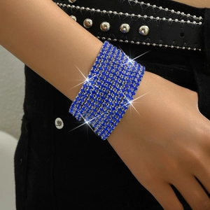 Detail of 8-row blue crystal stretch bracelet worn on wrist with sparkling rhinestones