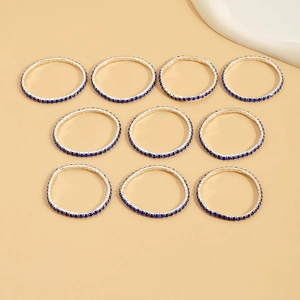 Set of 10 silver-tone elastic bracelets with shimmering deep blue zircon crystals