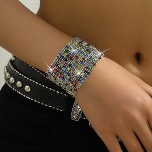 Detailed view of bohemian multilayer bracelet with colorful square rhinestones on wrist