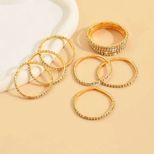 Detailed shot of sparkling gold elastic crystal rings and multi-row rhinestone bands
