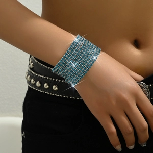 Macro detail of multi-row blue rhinestone stretch bracelet on woman's wrist
