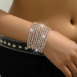 Detail of multi-row rose gold stretch bracelet with sparkling white zircons for women