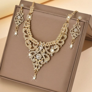 Vintage gold wedding jewelry set with crystal necklace and earrings on display