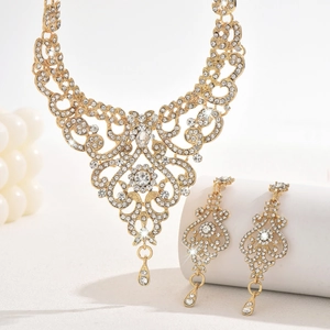 Exquisite hollow necklace and earring set featuring gold plating and clear crystals