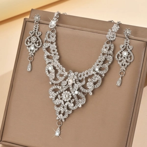 Vintage silver bridal jewelry set with crystal collar necklace and teardrop earrings