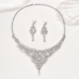 Vintage bridal jewelry set with sparkling rhinestones and teardrop earrings on satin
