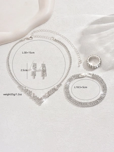 Macro shot showing detailed shiny rhinestones and silver alloy of the bridal jewelry set