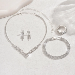 Sparkling silver bridal jewelry set with V-shaped rhinestone necklace and earrings