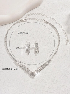 Detailed view of silver bridal jewelry set with V-shaped necklace and earring dimensions