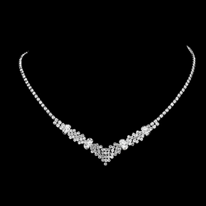 Detailed view of luxury silver V-shape necklace with sparkling rhinestones on black background