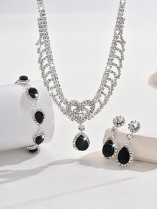 Detailed view of rhinestone water drop jewelry set with necklace earrings and bracelet