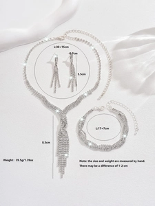 Detail showing bridal jewelry set with sparkling rhinestones necklace and long tassel earrings