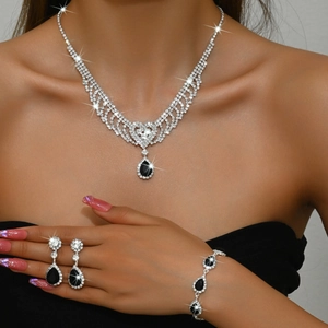 Detailed close-up of water drop jewelry set with black teardrop stones and rhinestones