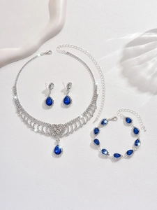 Detail view of sapphire blue teardrop jewelry set with necklace and earrings