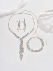 Close-up of sparkling bridal rhinestone necklace with long tassel and matching earrings