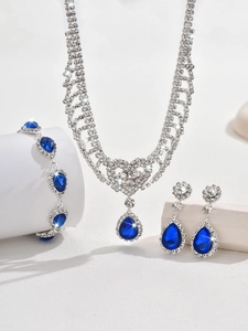 Detailed view of rhinestone water drop jewelry set with blue pear-shaped stones