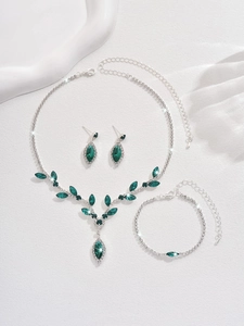 Detail of elegant V-shaped silver necklace set with marquise-cut green crystals