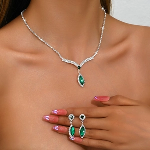 Luxurious bridal jewelry set with V-shaped green marquise gemstones and silver zircon necklace