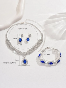 Detailed view of luxury blue sapphire jewelry set including necklace and earrings