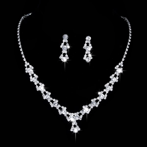 Elegant silver-tone bridal jewelry set with sparkling V-shaped crystal necklace and earrings