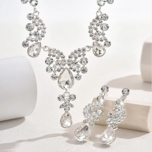 Detail of bridal jewelry set with sparkling drop-shaped crystals and tiered rhinestone design