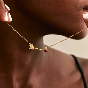 Gold 18K titanium steel necklace with Cupid arrow and red heart-shaped birthstone pendant