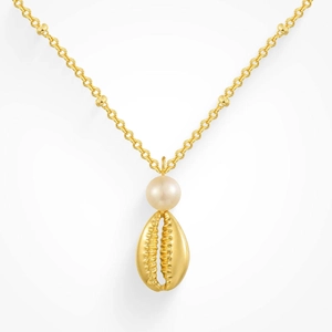 Detail of gold shell pendant and round pearl on a minimalist cross chain necklace
