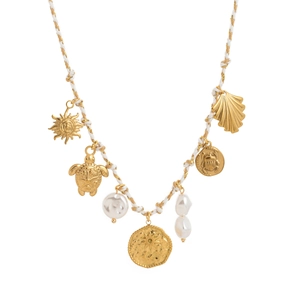 Detail view of gold ocean charms turtle sun shells and pearls on woven cord necklace