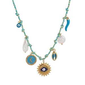 Detail of bohemian necklace with sea charms, pearl accents, and colorful braided rope