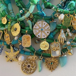 Bohemian velvet rope necklace with starfish, shell pendants and golden celestial charms