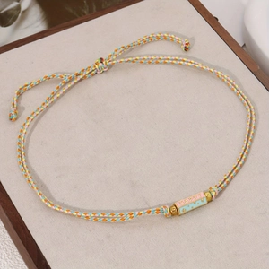 Colorful woven cord bracelet with HAPPY tarot pendant and adjustable clasp