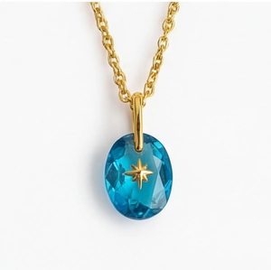 Vintage vergulde ketting met ovale blauwe natuursteen en polaris ster hanger