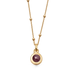Detail shot of purple gemstone pendant with 18K gold plated beaded chain necklace