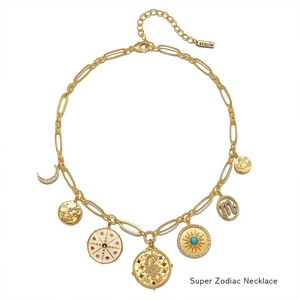 Detail of vintage zodiac charm necklace with gold pendants and colorful gemstone accents