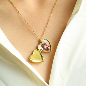 Elegant gold heart locket necklace for women, minimalist photo locket jewelry worn on model