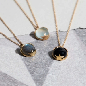 Vintage gold star-set pendant necklaces with natural mint green and black gemstones
